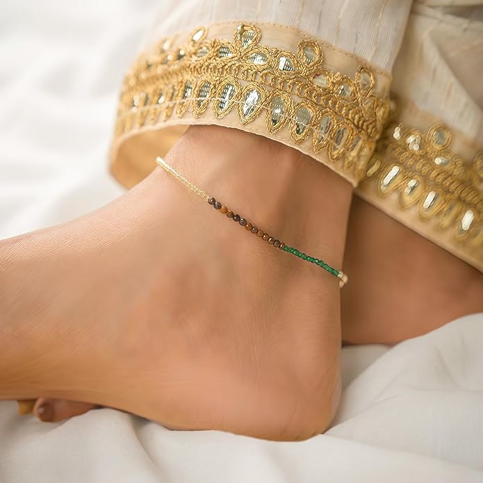 Close-up of faceted pyrite beads on a Dhan Yog anklet