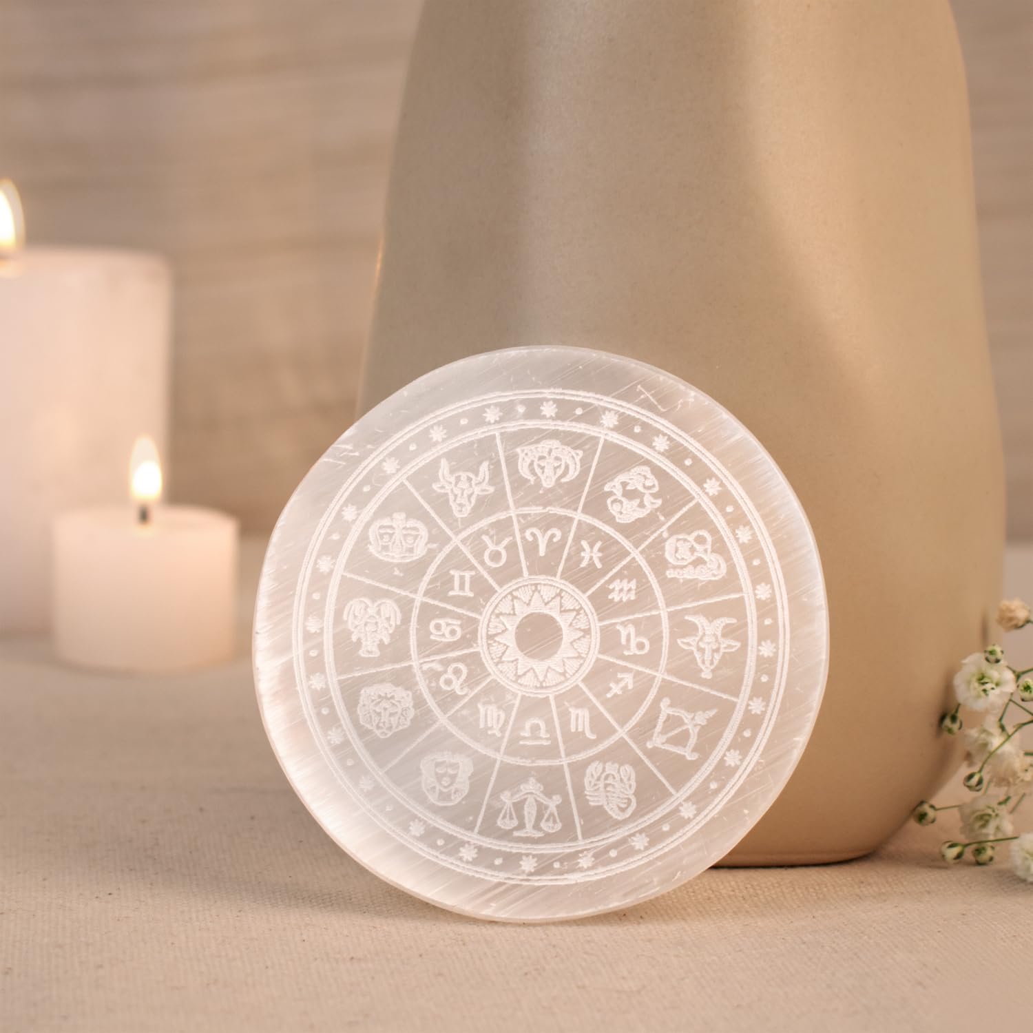 White Moroccan selenite crystal charging plate for gemstone cleansing.