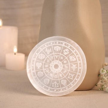 White Moroccan selenite crystal charging plate for gemstone cleansing.