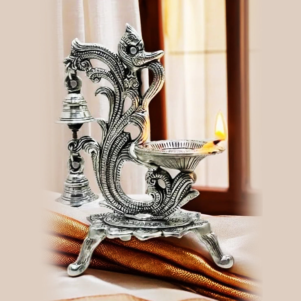 Decorative Oil Lamp Diya Stand with Bells, Antique Silver Finish, Traditional Peacock Design